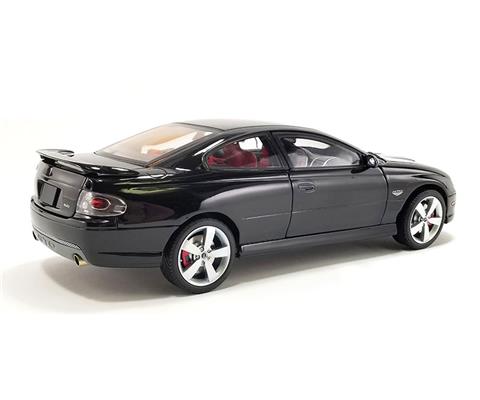 Cars GMP 18981 2006 Pontiac GTO in Phantom Black with Red Interior Features Include Full Diecast Body Fully Detailed Interior Fully Detailed 6.0 LS2 V8 Engine Opening Doors Hood and Trunk Fully Detail...