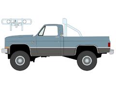 AUTO WORLD #AWSP216-A - 1987 Chevrolet Silverado Fleetside 4x4 Pickup Truck with Roll Bar and Push Bar in Light Blue with Steal Gray Lower
