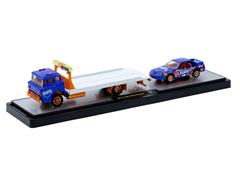 M2MACHINES #56000-TW44-C-SP - Fanta - 1990 Ford C-8000 Flatbed Tow Truck and 1990 Ford Mustang GT with Orange Chrome Rims